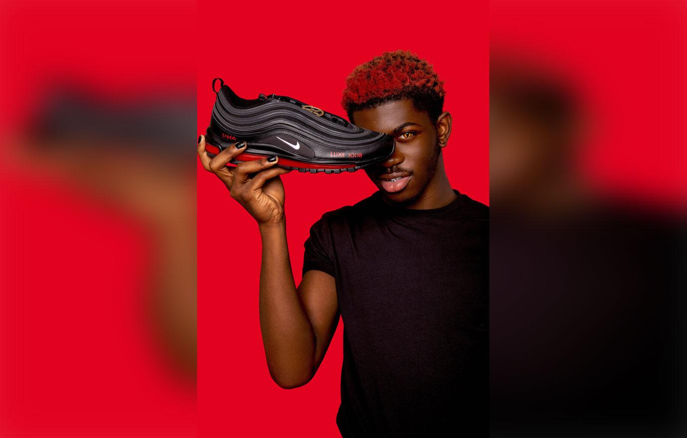 lil nas x poses with his custom satan shoes