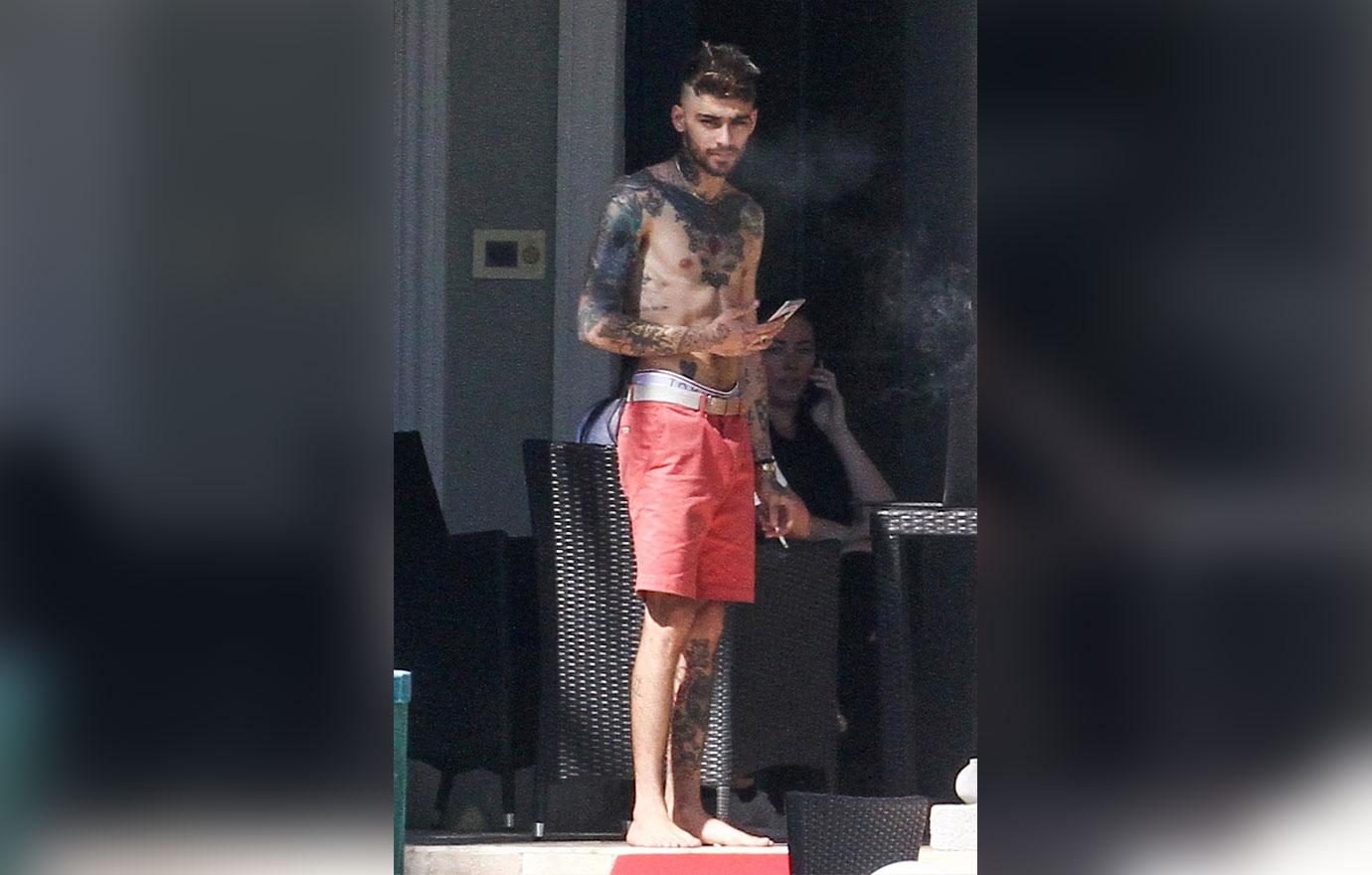 Zayn Malik looks extremely thin as he chain smokes by the pool after split from Gigi Hadid