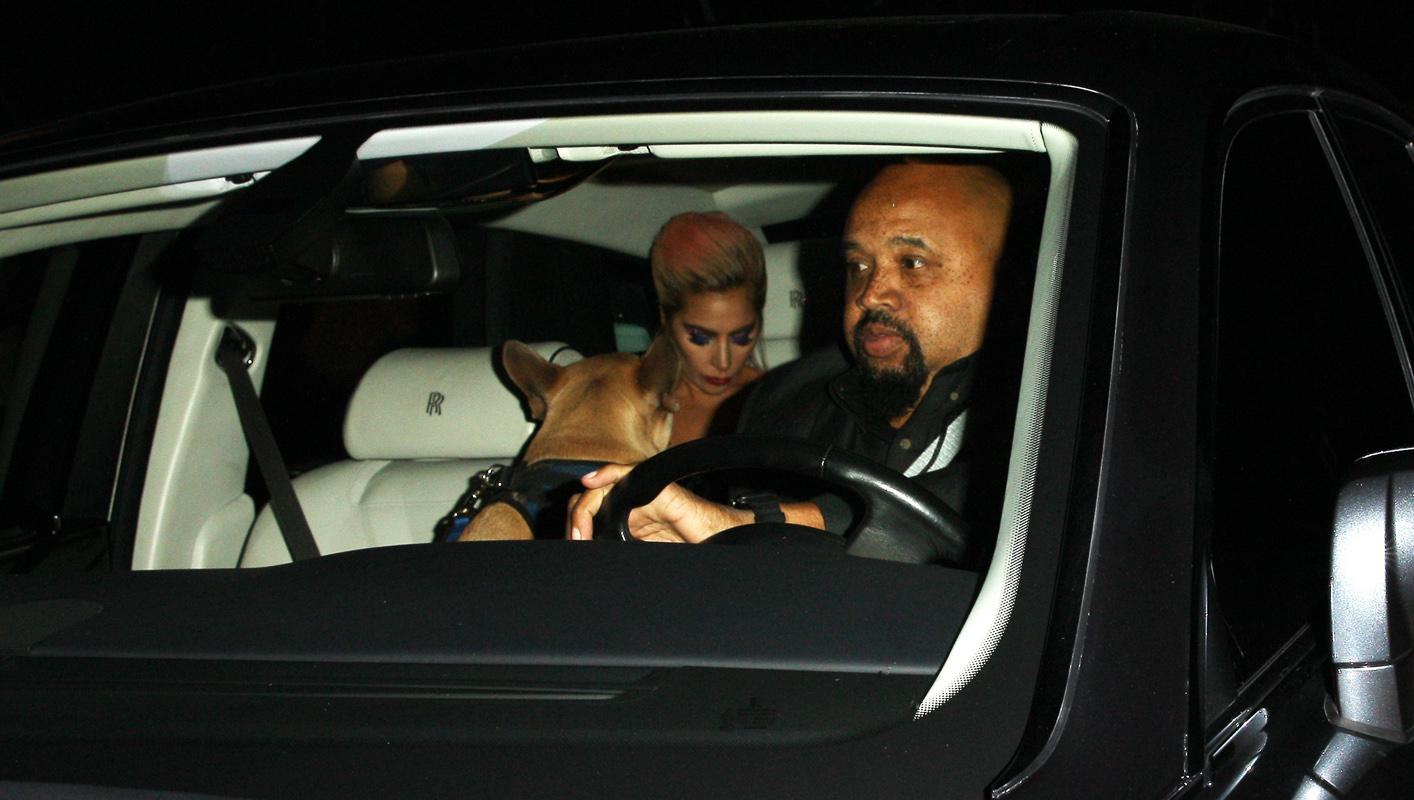 Lady Gaga goes to the Peppermint Club with a guard dog sitting in the front seat of her Rolls Royce after attending the 59th Annual Grammy Awards