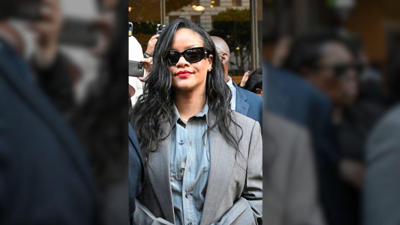 Image of Rihanna attended Celine Dion’s Paris concert in black and bronze pleated Ferragamo dress.