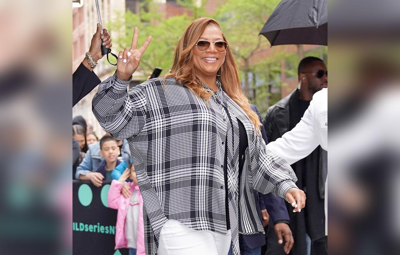 Queen Latifah Wearing Sunglass And Flannel And Holding Up Peace Sign queen latifah brother dead