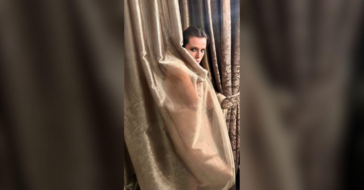 former disney star bella thorne poses nude wraps herself curtain photo