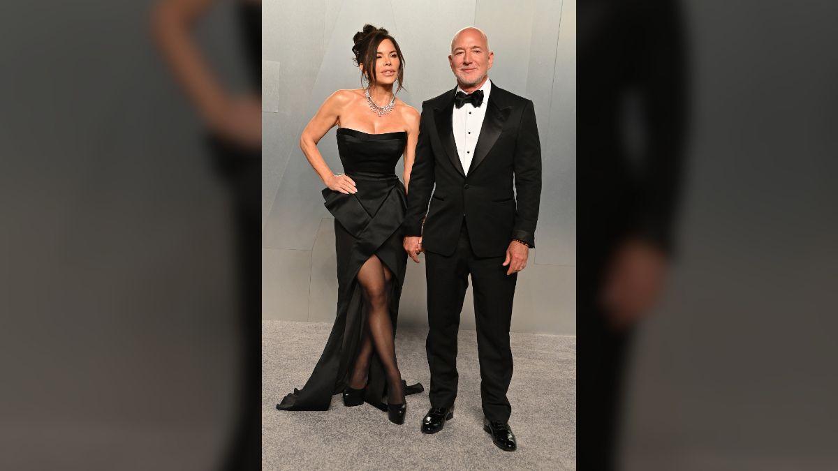 Photo of Lauren Sánchez and Jeff Bezos matched in black-and-white while attending the 2026 Vanity Fair Oscars after-party.