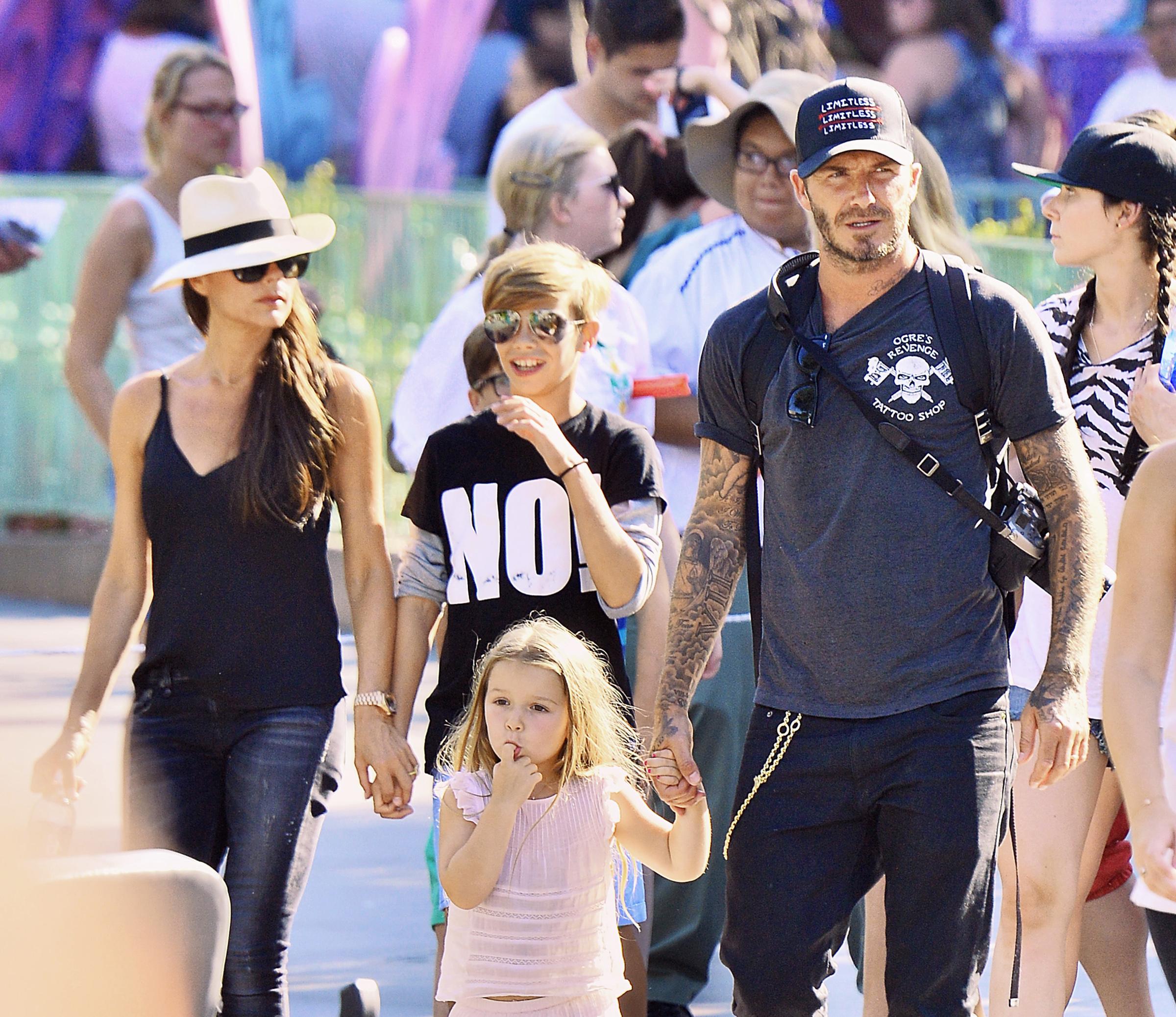 David Beckham and Victoria Beckham spend the day with their kids at Disneyland in Anaheim, CA. **ORIGINAL DATE TAKEN 08/24/15**