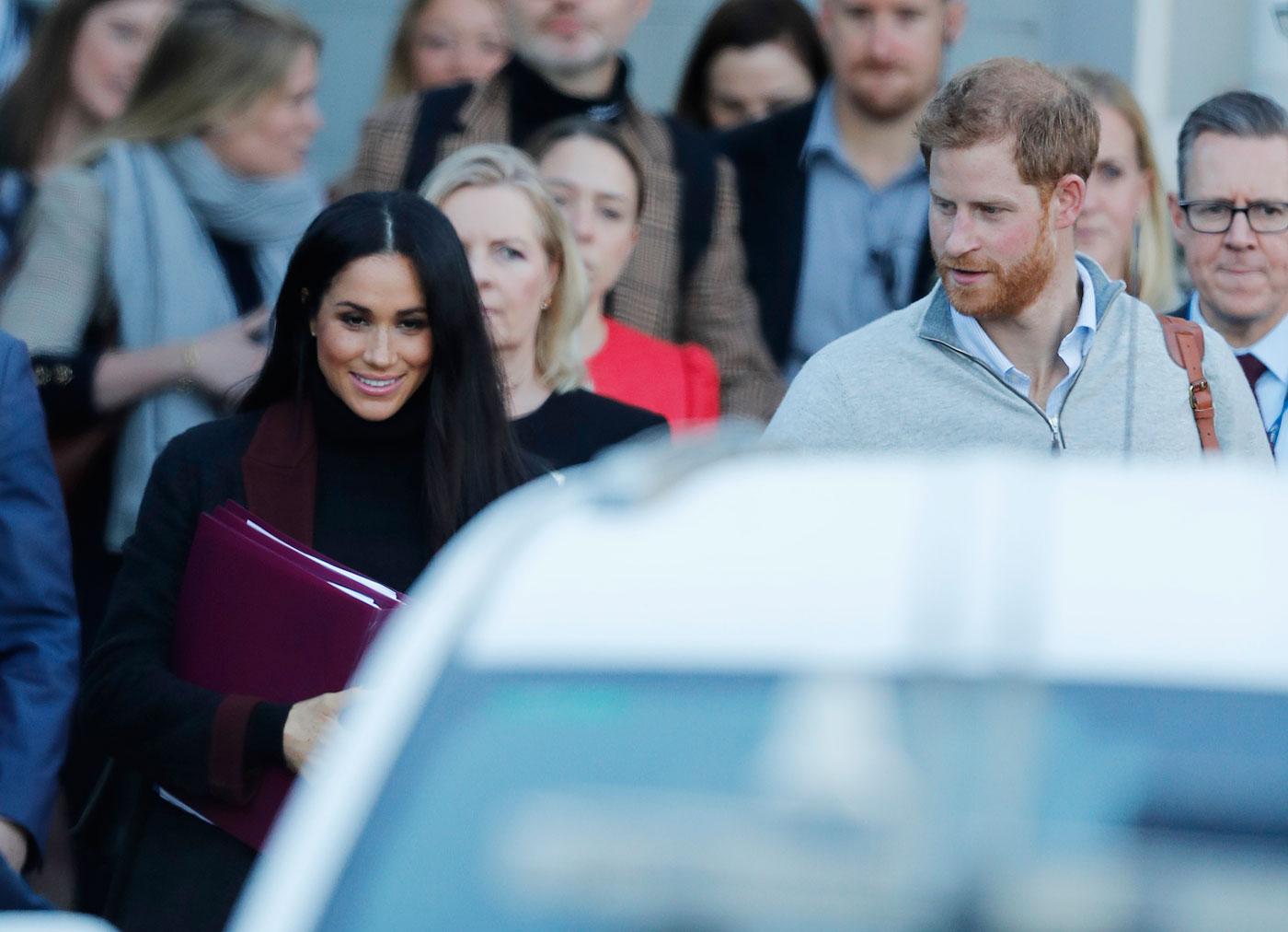 Prince Harry and his wife Meghan Markle pictured arriving in Sydney.