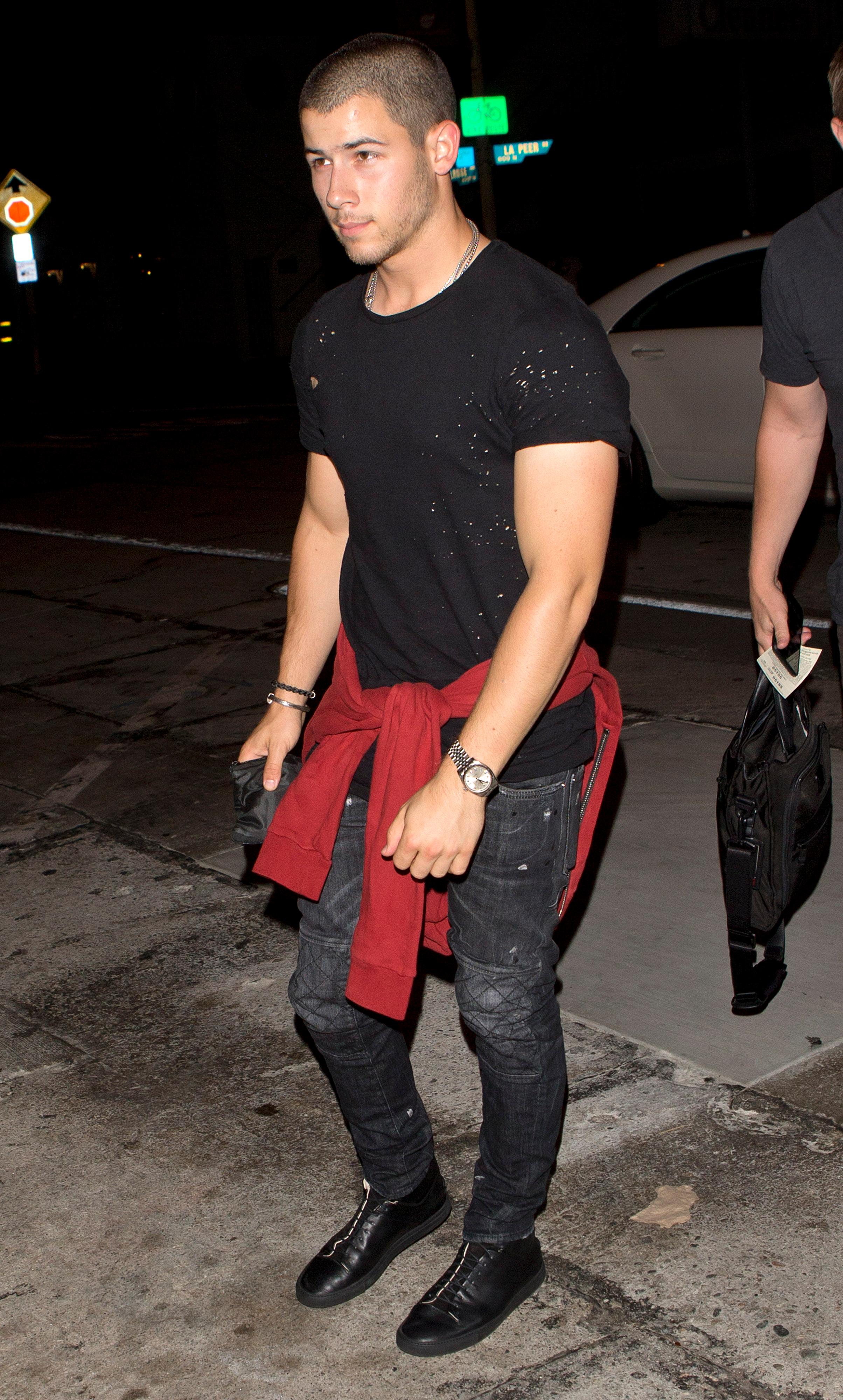 Nick Jonas looking very Buff in a fitted t shirt shirt seen arriving for dinner at &#8216;Craigs&#8217; Restaurant in West Hollywood, CA