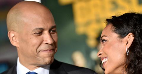Corey Booker smiles at Rosario Dawon on the red carpet - and she smiles back.