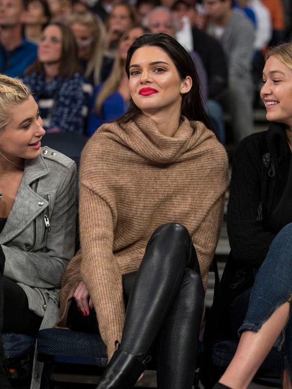 Kendall Jenner sits court side during NY Knicks game at Madison Square Garden with with Hailey Baldwin and Gigi Hadid