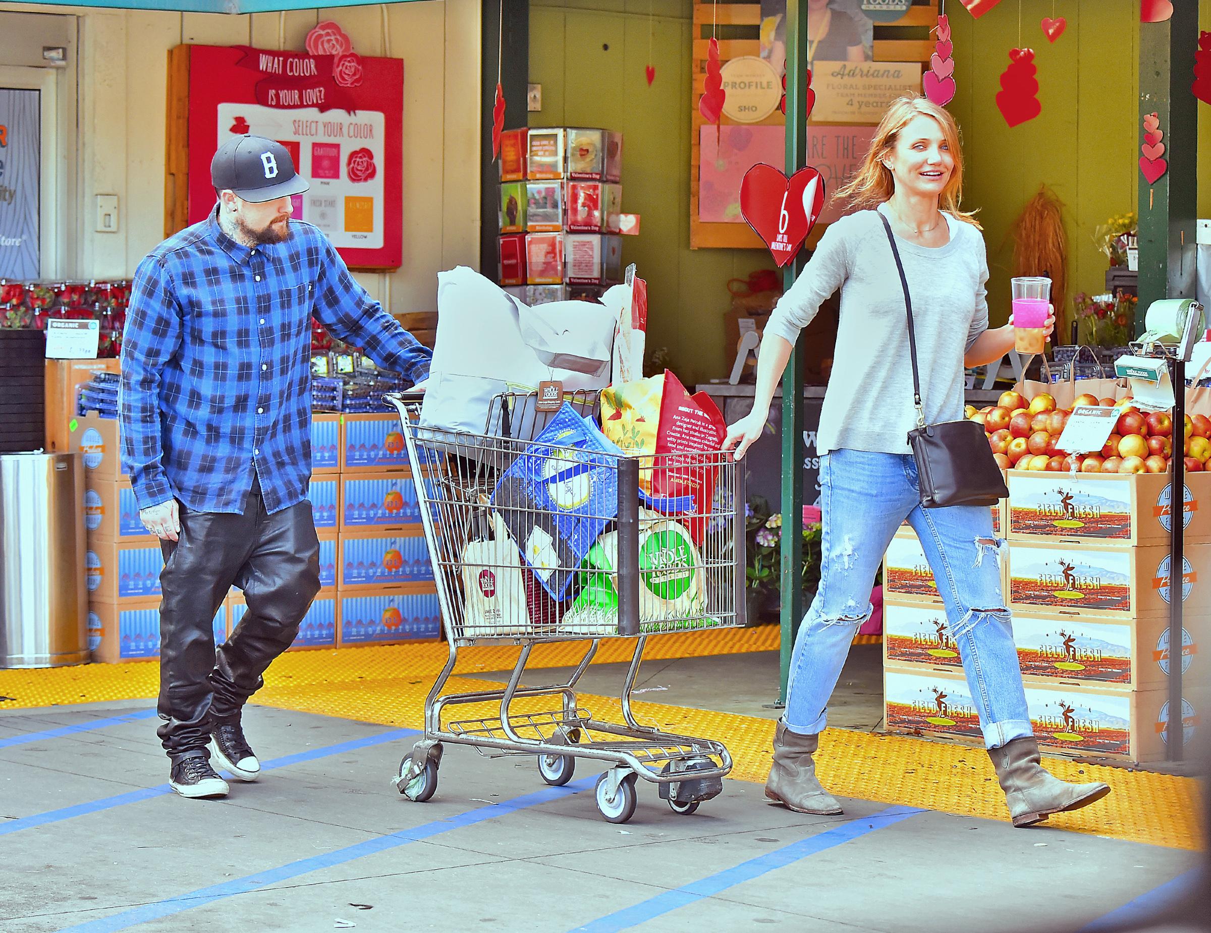 EXCLUSIVE: **PREMIUM RATES APPLY** Newlyweds Cameron Diaz and Benji Madden are all smiles while grocery shopping at Whole Foods in Los Angeles, CA.