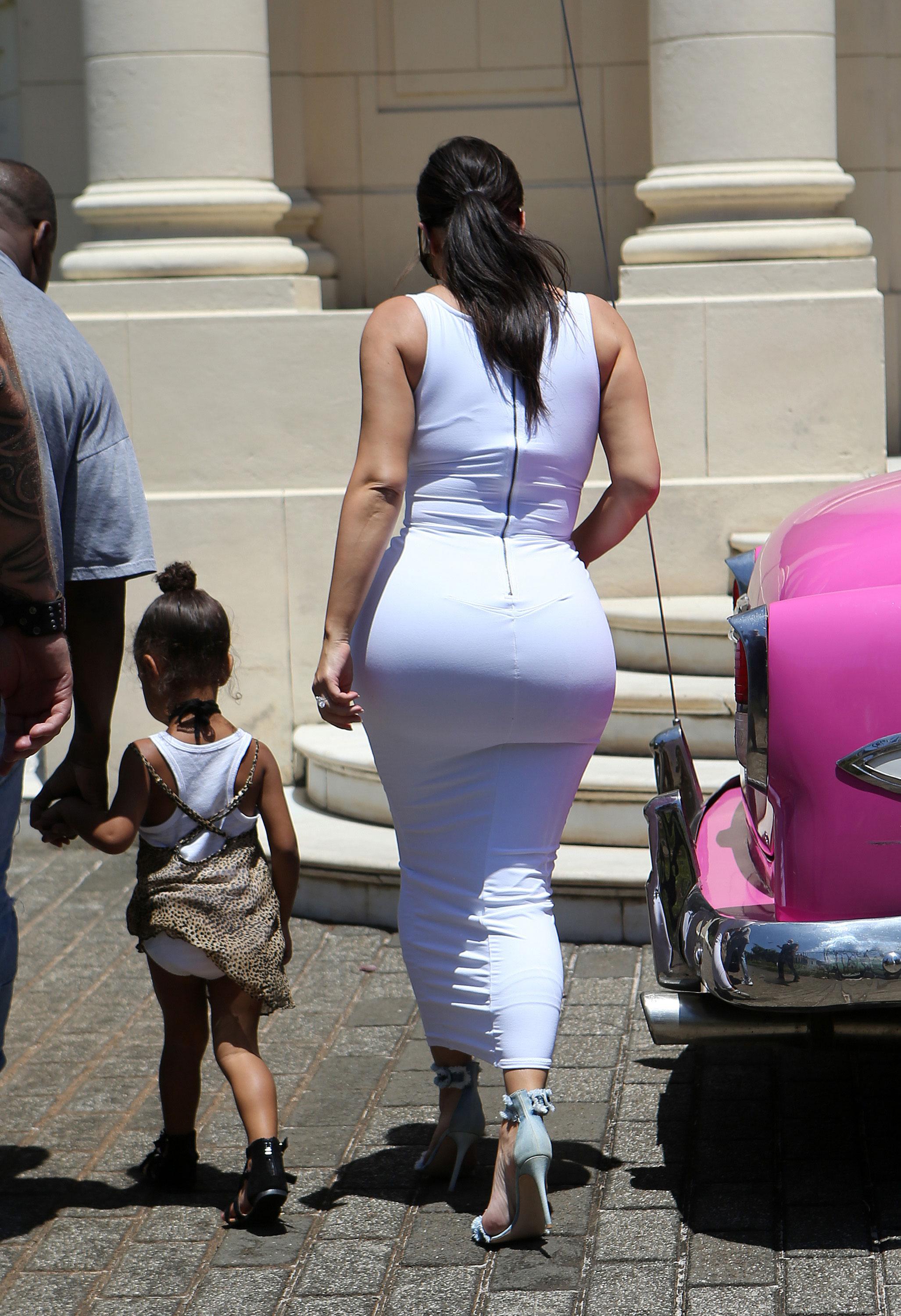 Hot ass waking Bootylicious Kim Kardashian Exposes Larger Than Ever Butt In Sexy Skintight White Dress