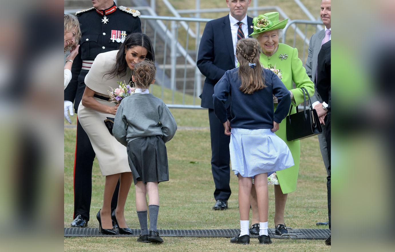 meghan markle makes the queen smile first joint appearance 05