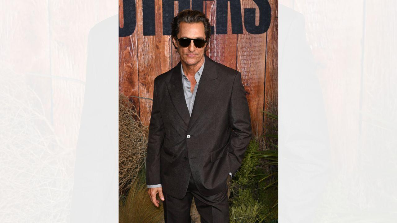 Image of Matthew McConaughey neglected to pull his pants up for the embrace.  