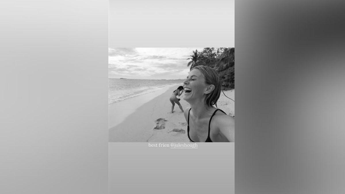 Image of Julianne Hough bared her toned body in a black bikini.