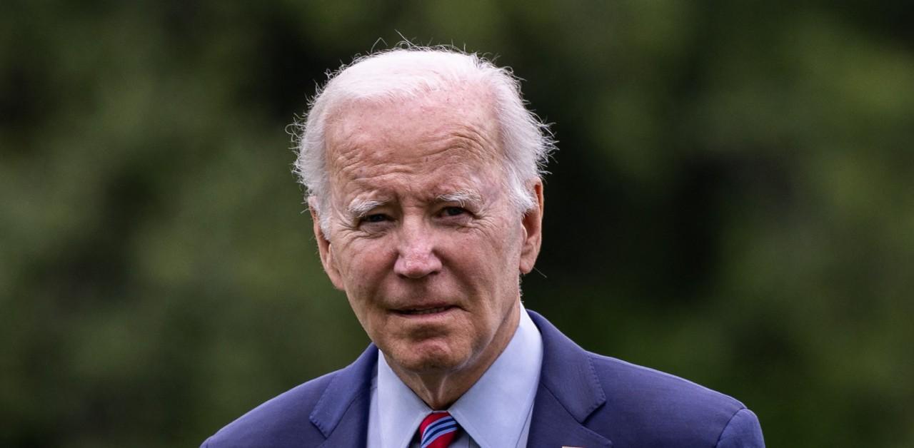 president joe biden bumps head helicopter doorframe after tripping onstage