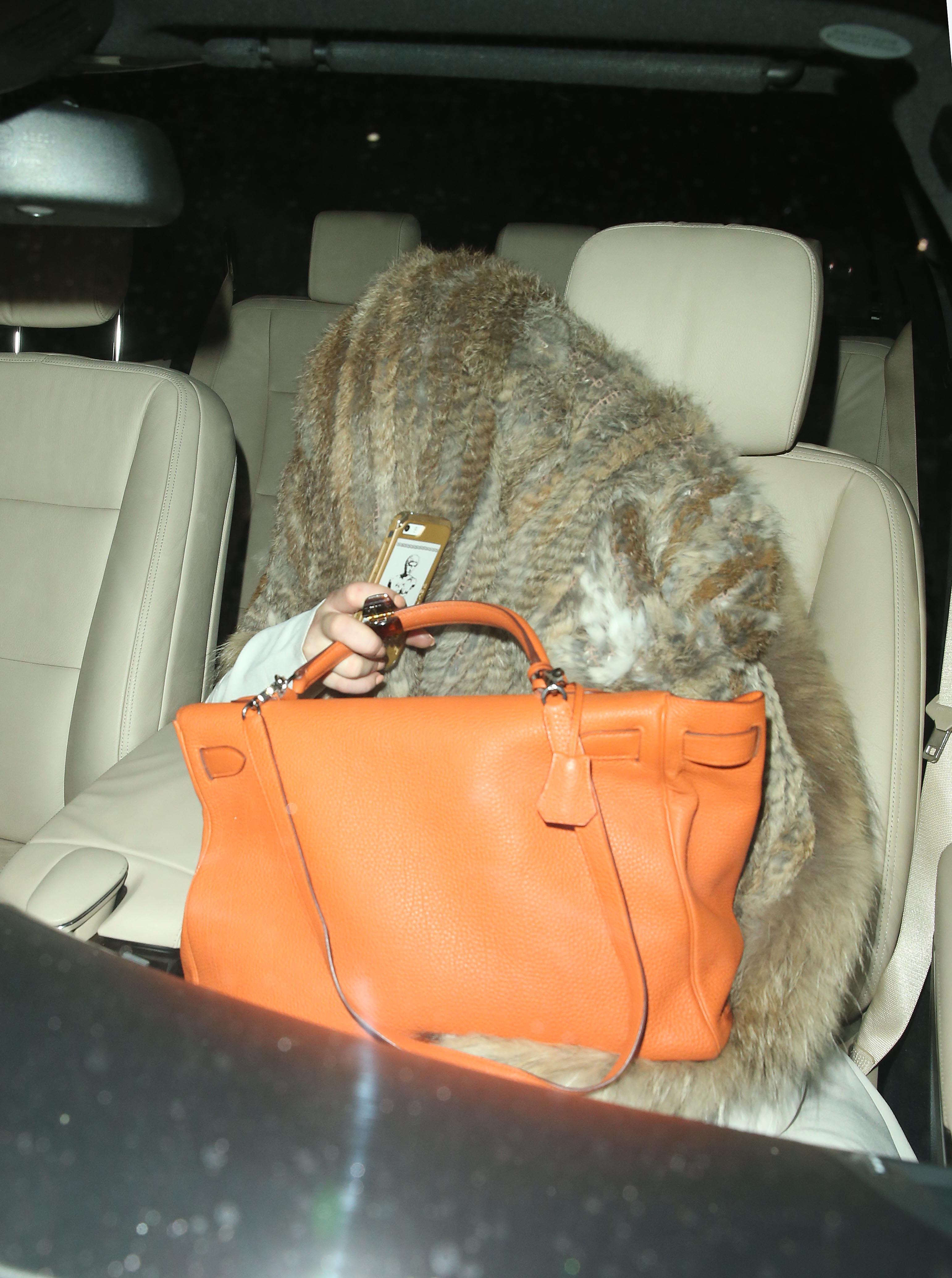 Lindsay Lohan hides away from the paparazzi in London at 3am