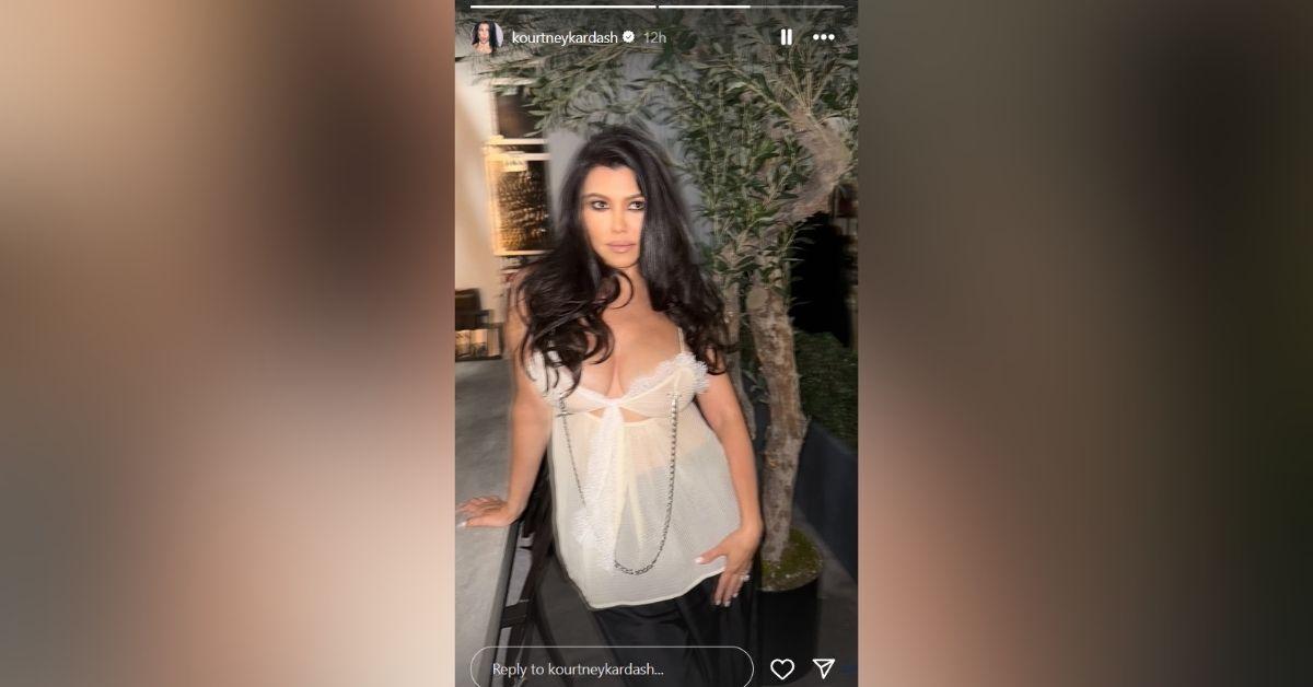 image of Kourtney Kardashian showed off her curves in a lace top.