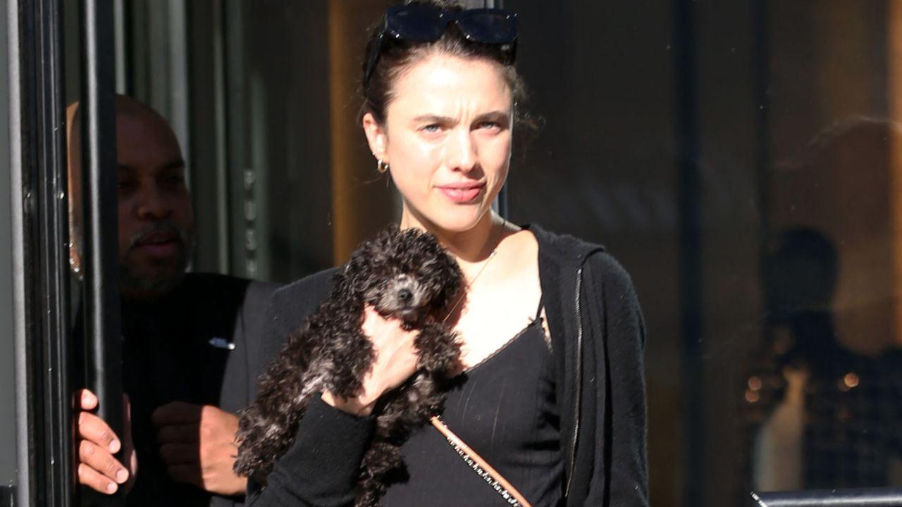 Image of Margaret Qualley and her dog.