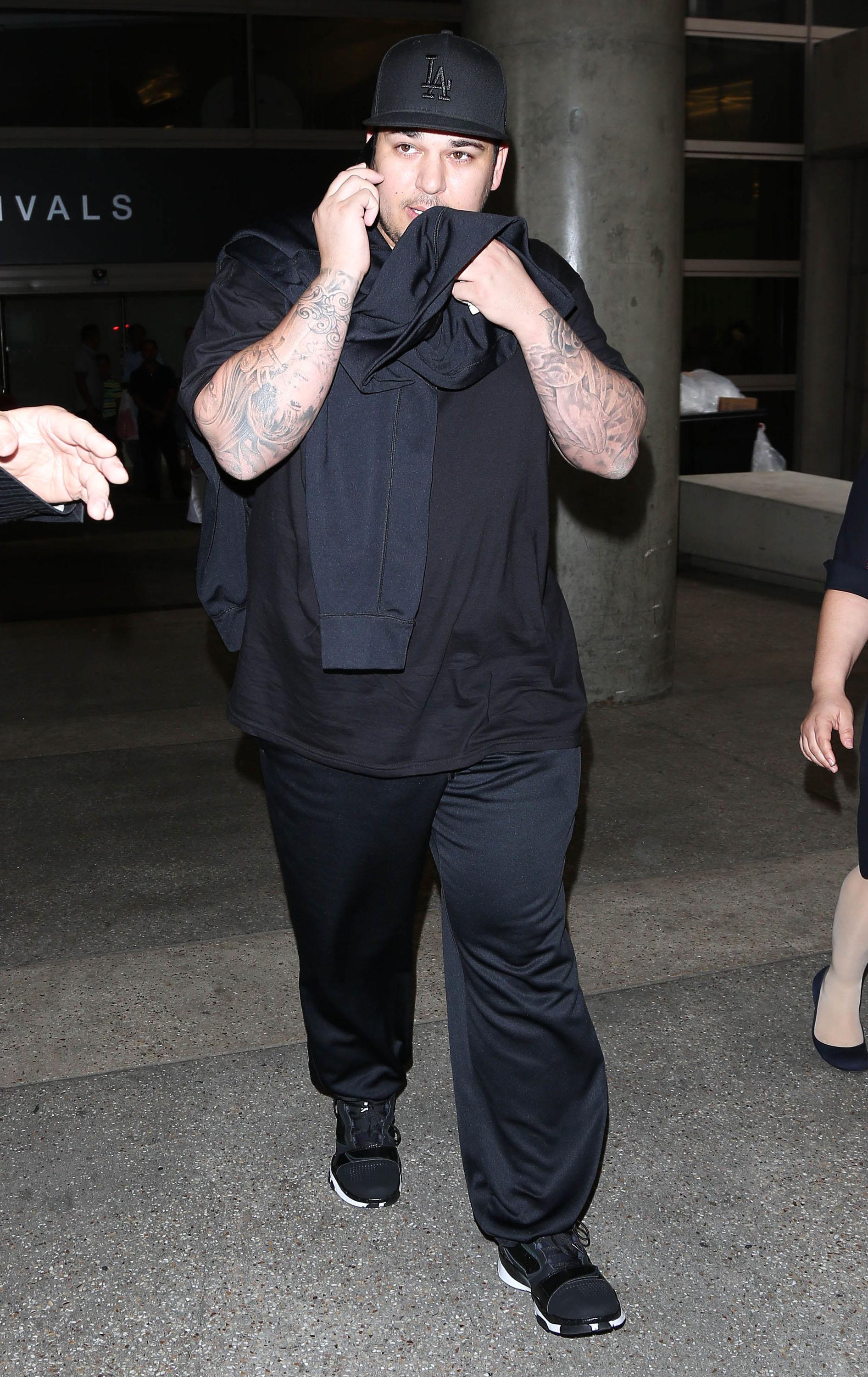 Fat Rob Kardashian Arriving On A Flight At LAX