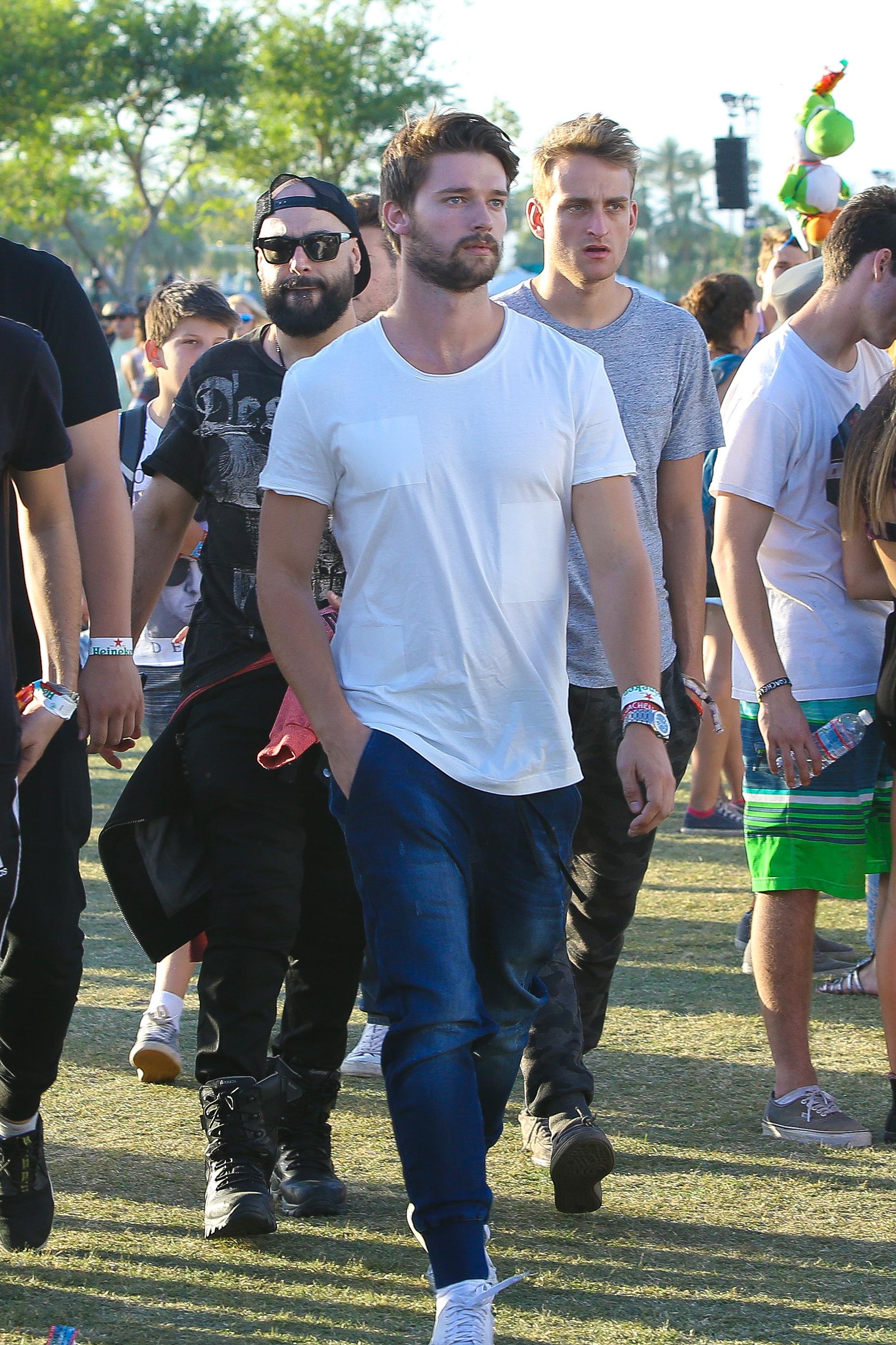 Patrick Schwarzenegger roams the lawn with his buds at Coachella