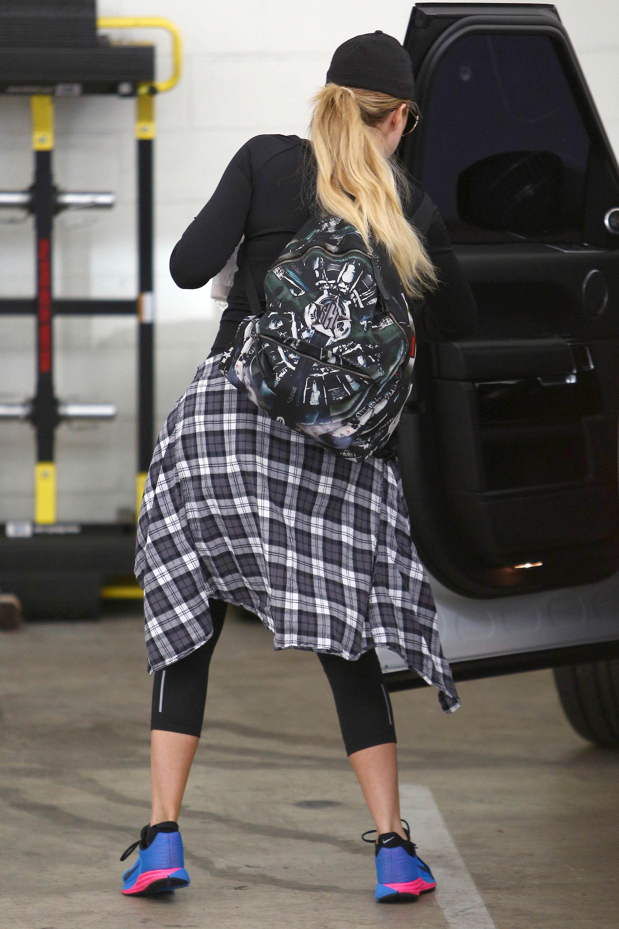 Khloe Kardashian works on her fitness with a personal training session