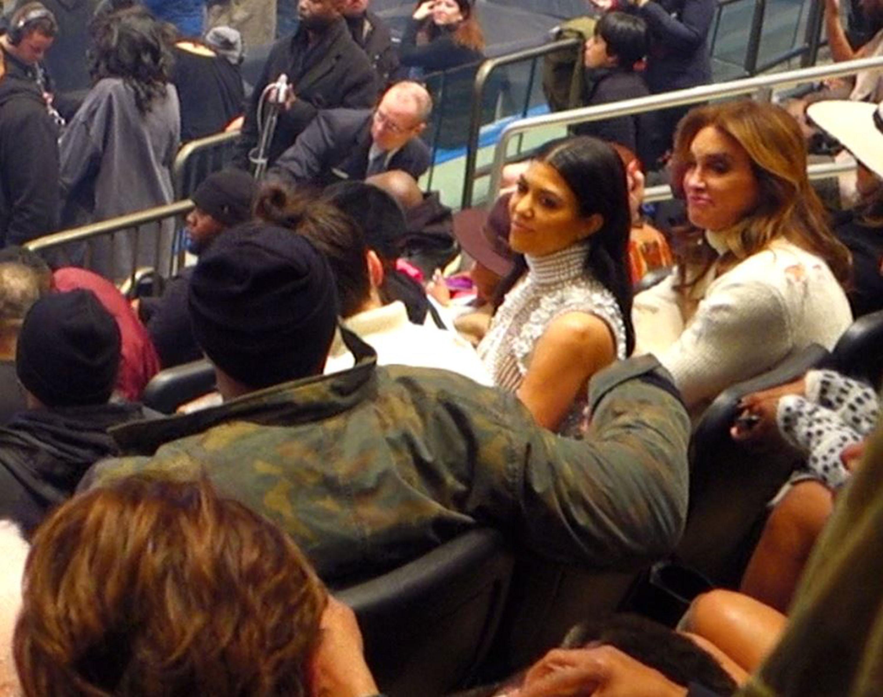 Kourtney Kardashian makes expressions when talking to Lamar Odom while Caitlyn Jenner listens on at Kanye West&#8217;s Yeezy show in NYC.