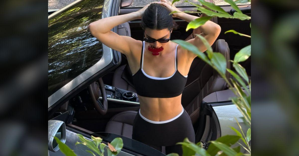 Image of Kendall Jenner stunned in a skimpy sports bra and shorts.