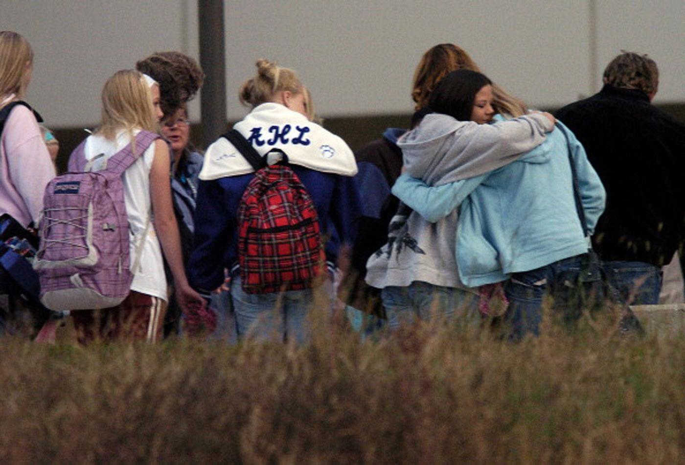 BAILEY COLO OCT. 04 2006&#8211; After 8 days students went back to school, Thursday, Oct. 05, 2006, at Platte Canyon High School in Bailey. Many of the students, along with parents and teachers, stopped to pray around a flagpole near the entrance of the school