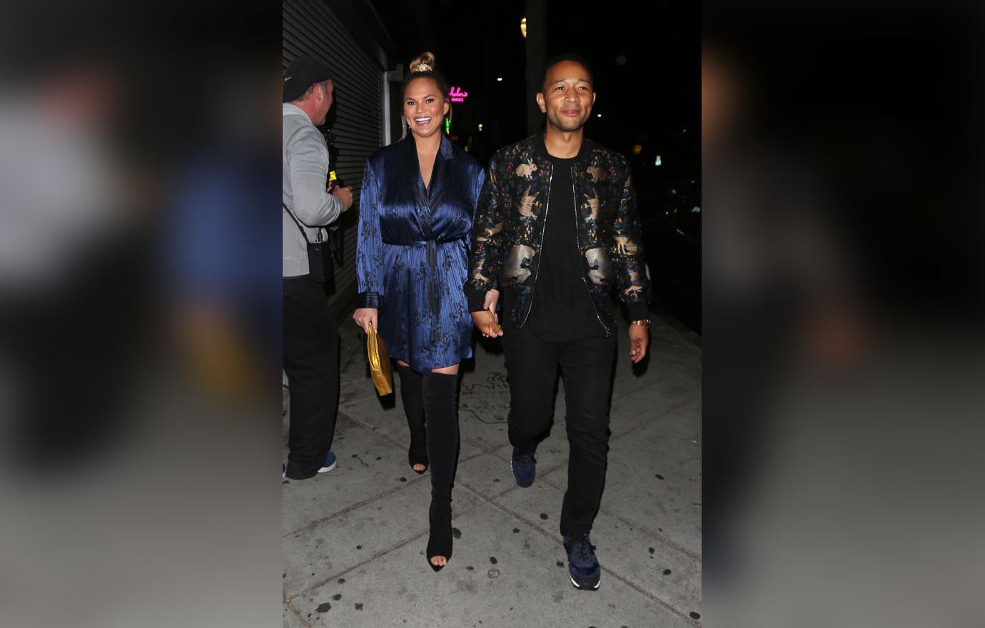 Chrissy Teigen and John Legend walk hand in hand as they exit Jon &amp; Vinny&#8217;s restaurant after dining with friends