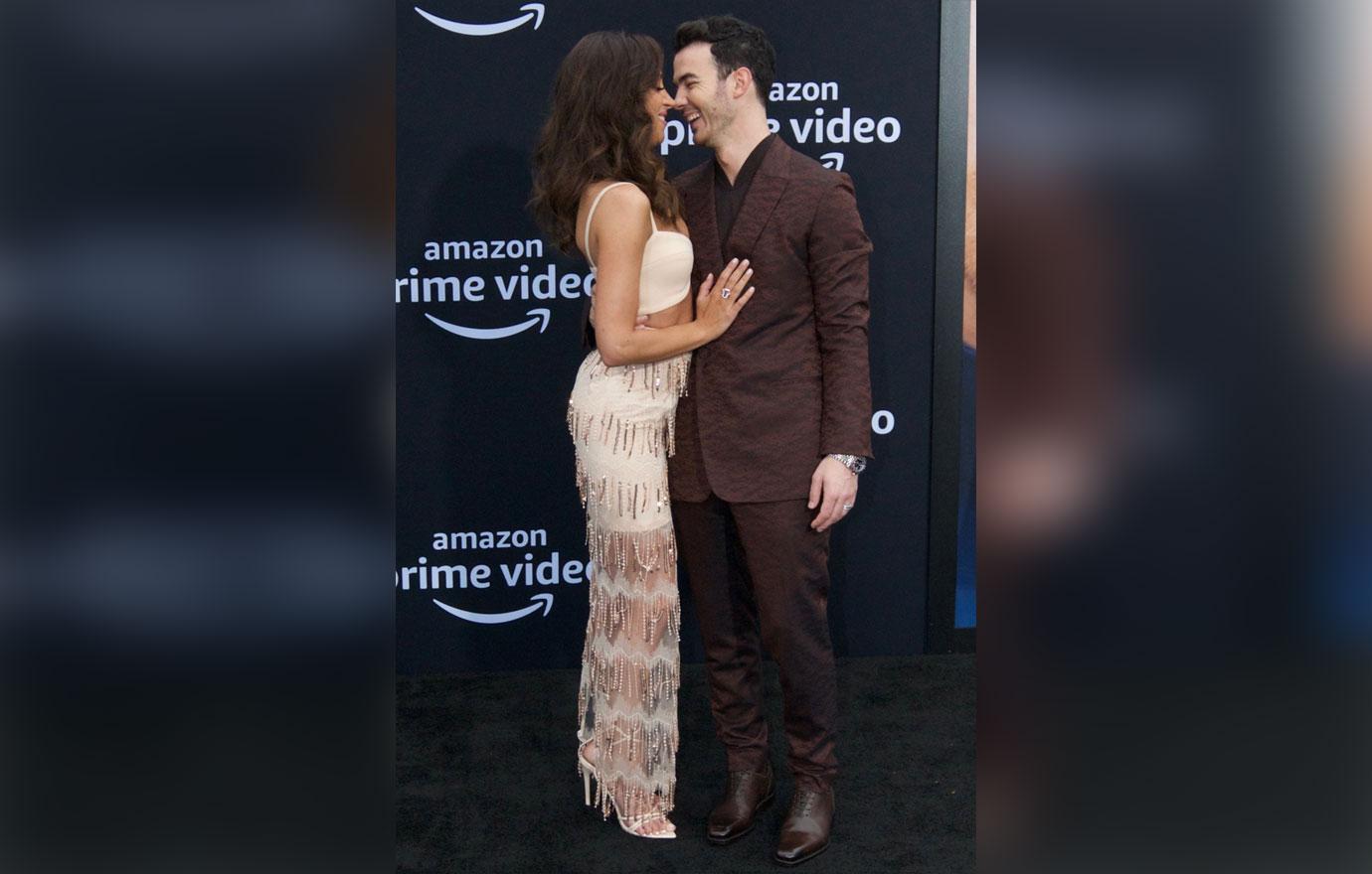 Kevin and Danielle Jonas Cuddling On red Carpet