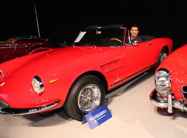 Mario Lopez checks out the 1967 Ferrari 330 GTS at Auctions America California Sale at The Barker Hangar in Santa Monica