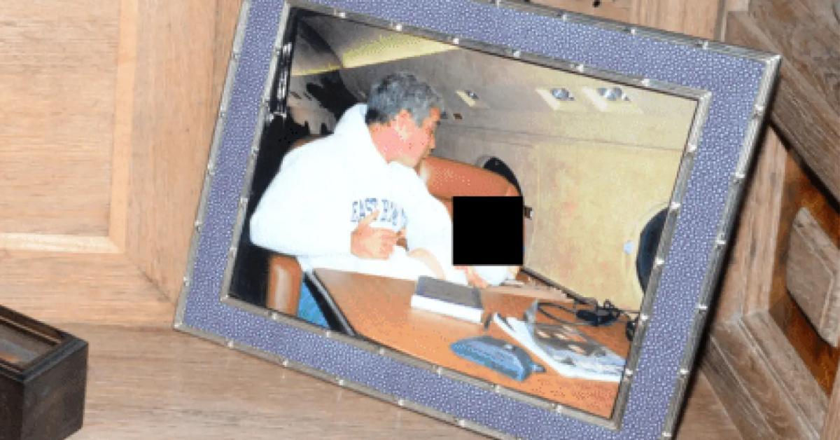 Image of Jeffrey Epstein made a kissy face at a small child.