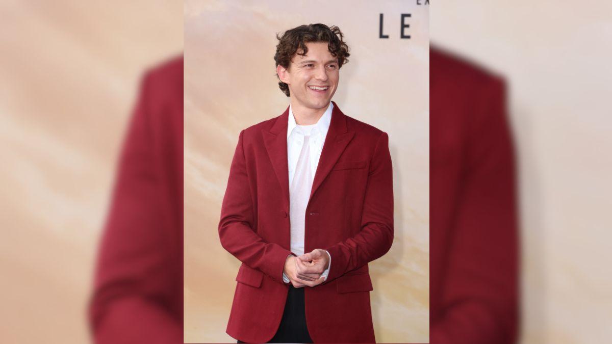 Image of Tom Holland was shocked by vomiting on camera after eating spicy wings during 'Hot Ones' interview.
