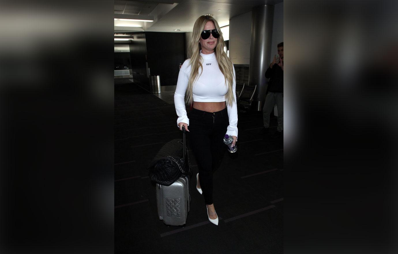 Kim zolciak walking through airport with crop top