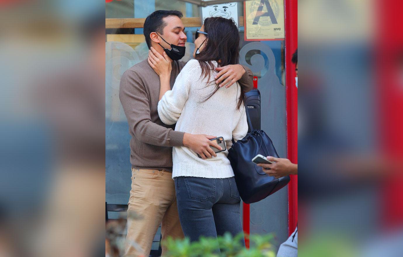 Katie Holmes and boyfriend Emilio Vitolo Jr. are all smiles as they continue another steamy make-out session outside his restaurant in NYC