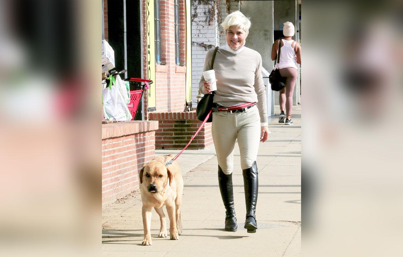 selma blair smiles while making a coffee run with adorable dog scout in studio city