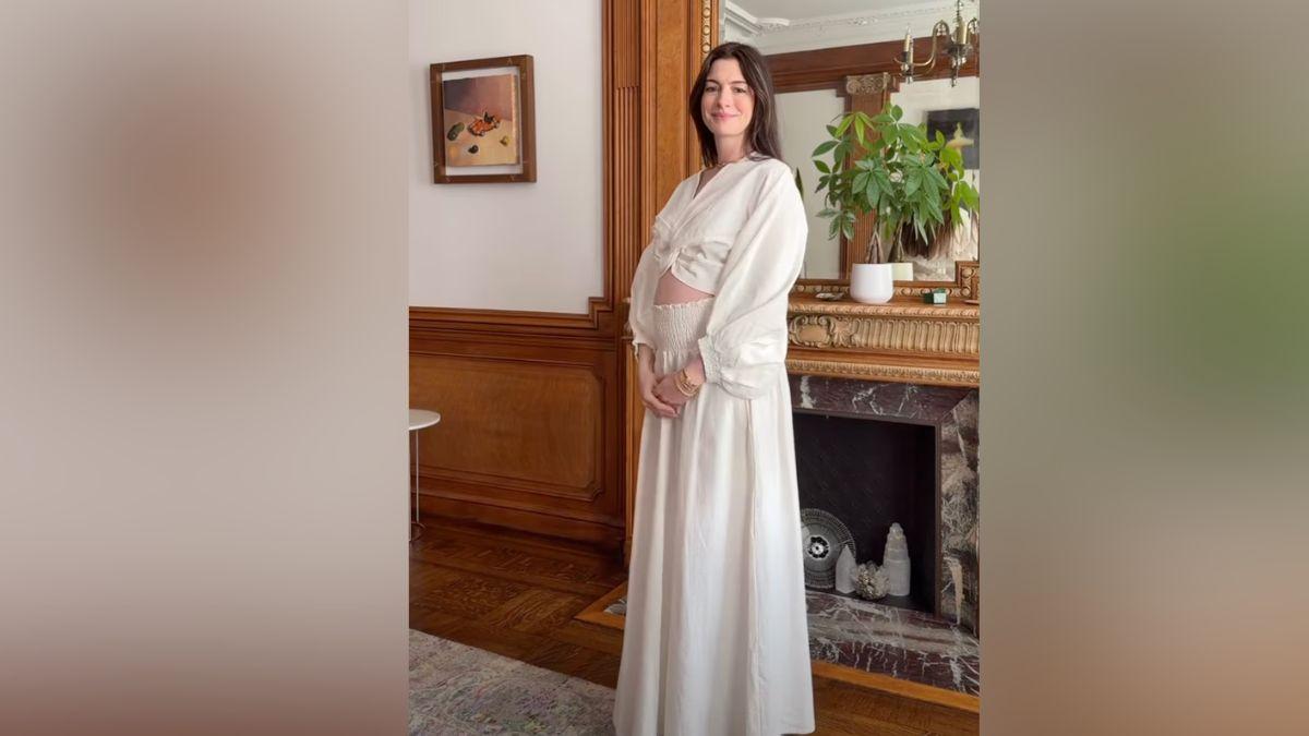 Image of Anne Hathaway debuted her baby bump in a video set to the tune of 'Baby, I'm Yours.'
