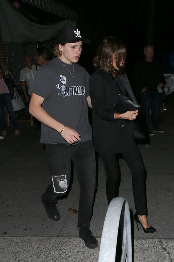 brooklyn beckham helping mom victoria beckham to car