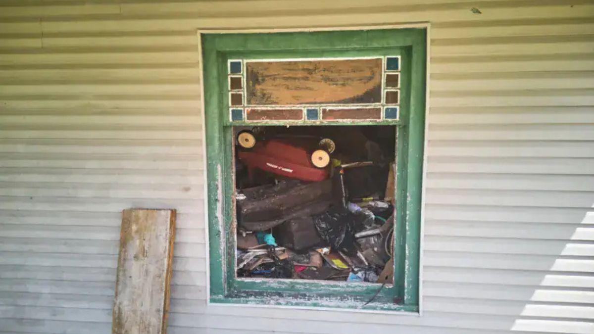 image of Windows were blocked by piles of clutter, limiting visibility into several rooms of the residence.