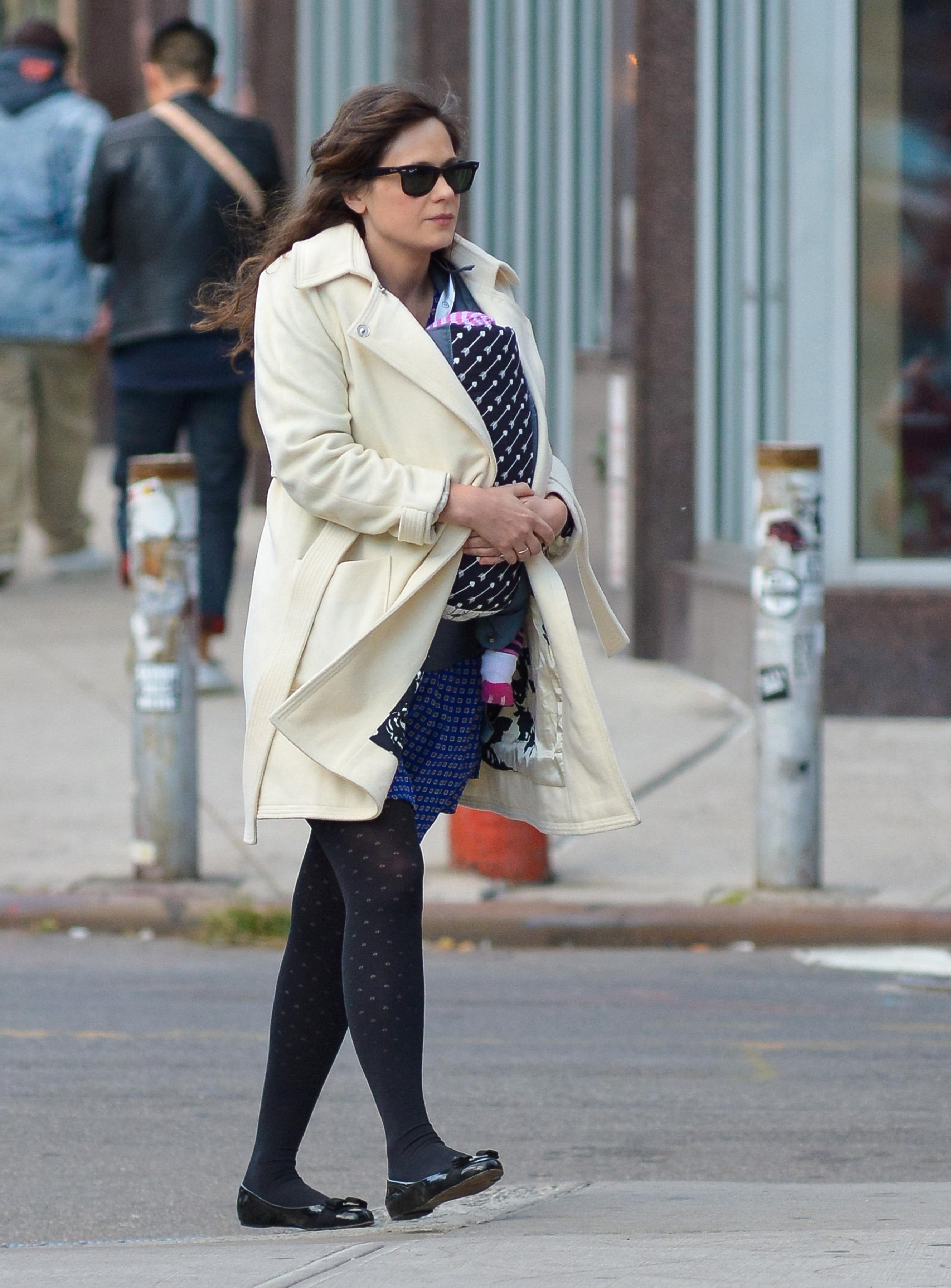 Zooey Deschanel carries her baby in downtown NYC