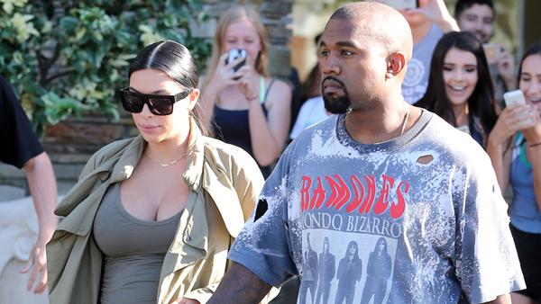 Pregnant Kim Kardashian and Kanye West get mobbed by fans as they leave the cinema in west lake