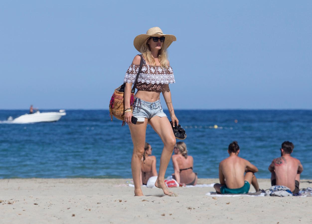 Supermodel Doutzen Kroes shows off her incredible bikini body as she soaks up the sun on the beach in Ibiza.