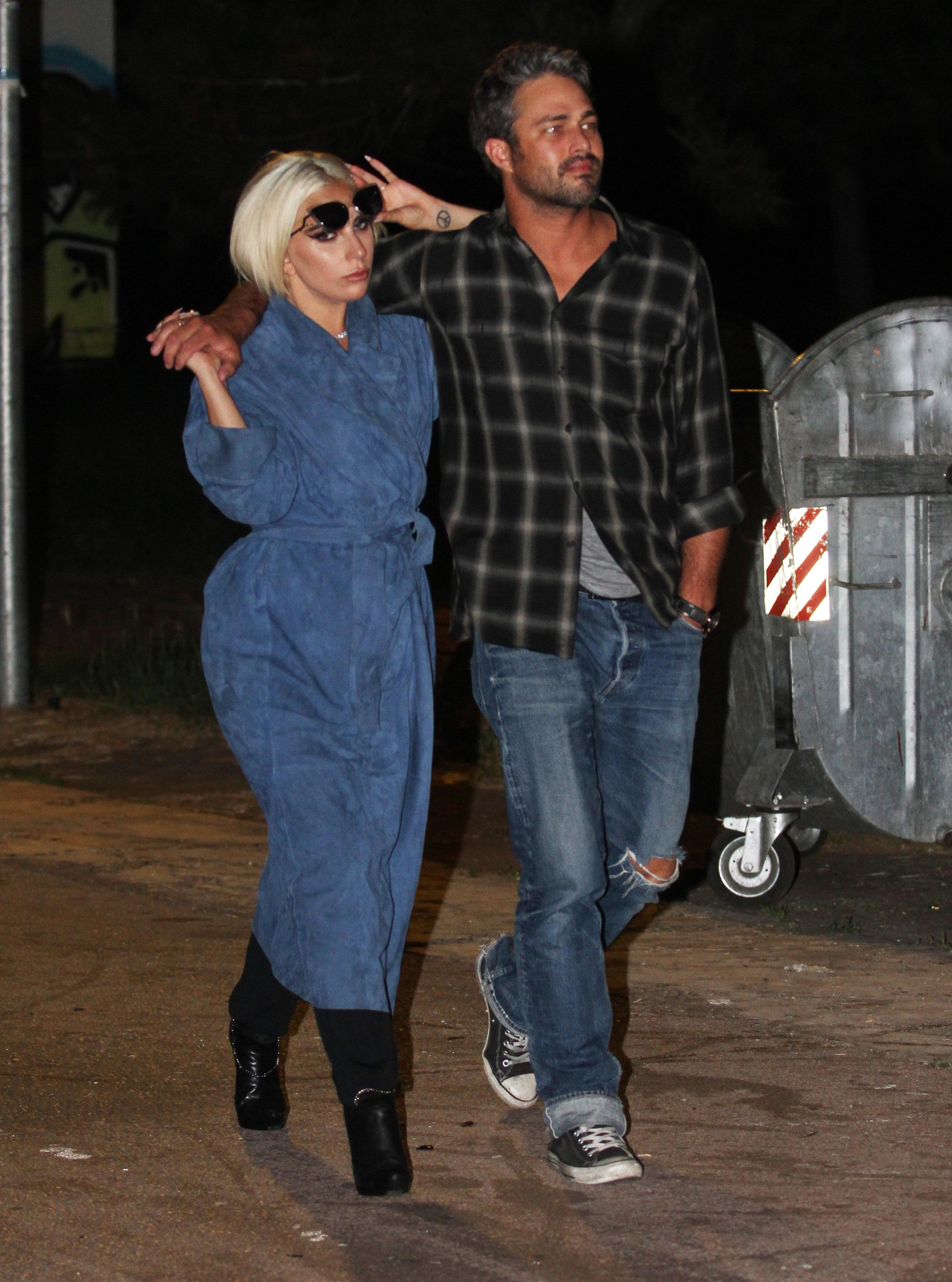 Lady Gaga, wearing face crystals, and her fiance Taylor Kinney out and about in Serbia