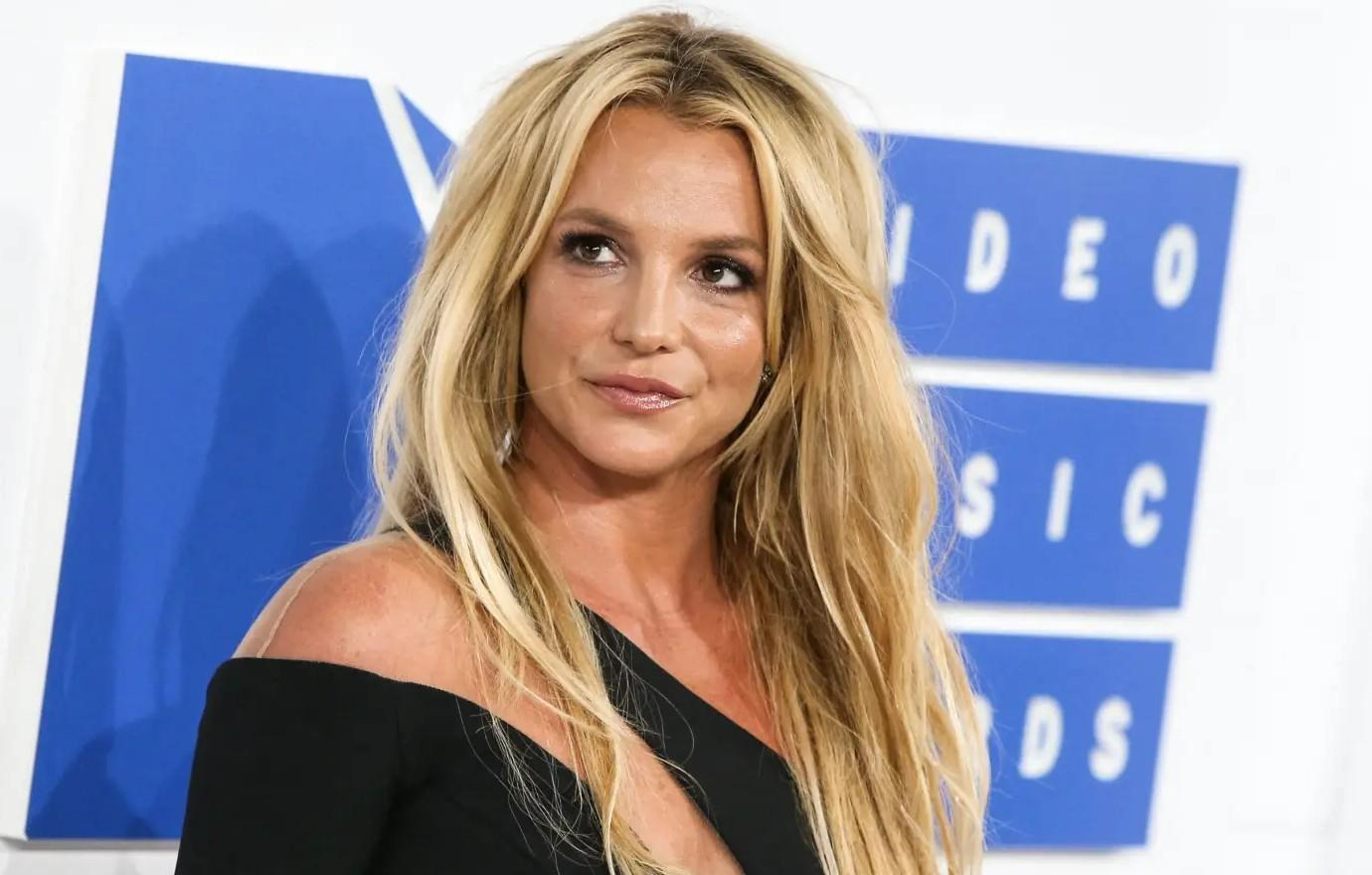 Britney Spears' side boob pops out of her tight minidress as pop star shows  off raunchy dance moves in NSFW new video