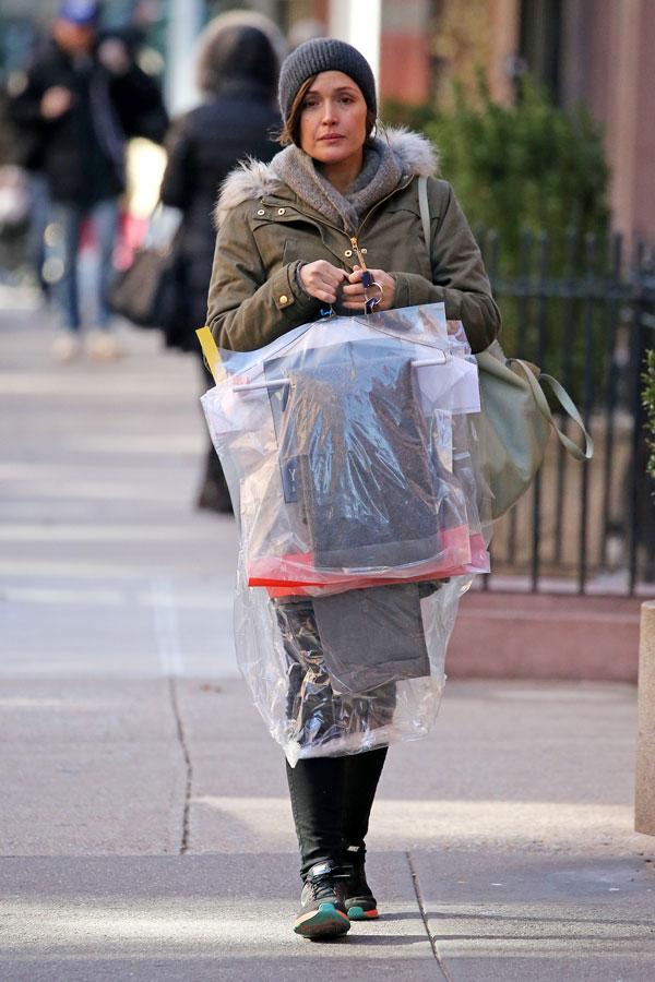 pregnant rose byrne budled up