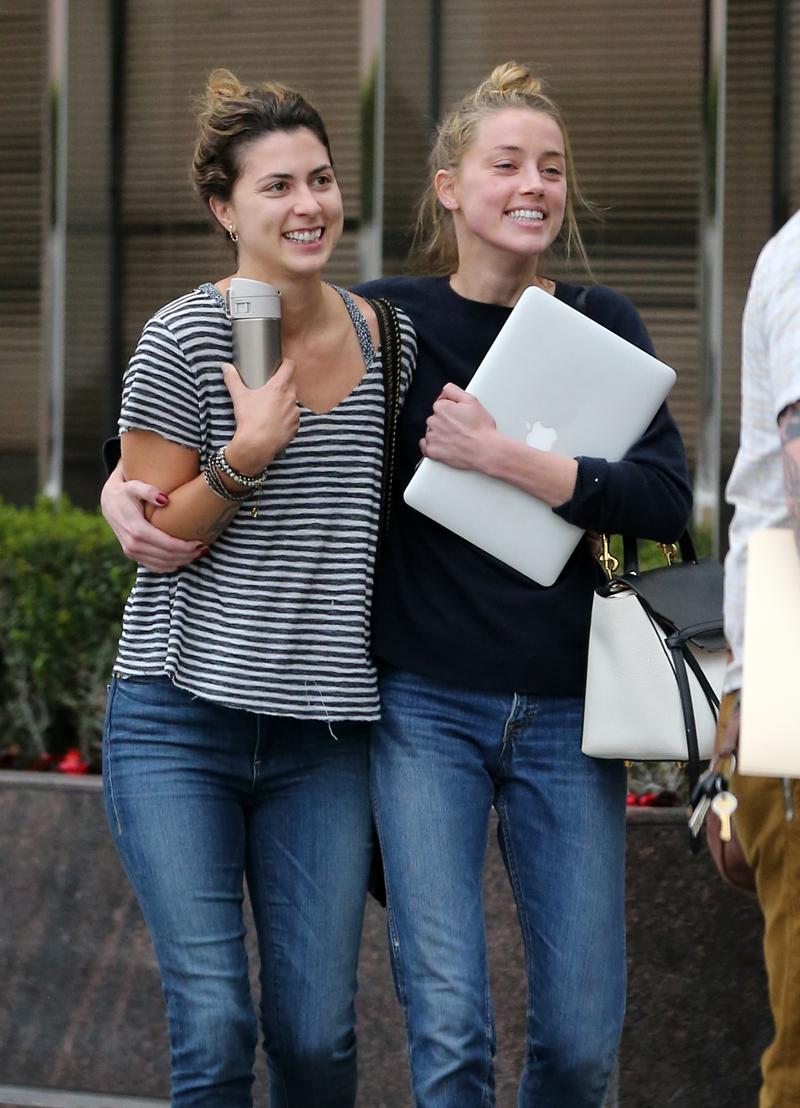 EXCLUSIVE: **PREMIUM RATES APPLY** Amber Heard all smiles following four hour meeting with her legal team in Los Angeles