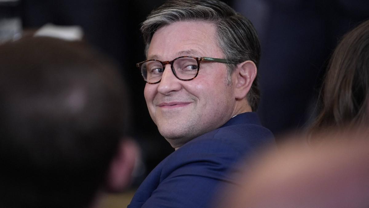 Image of Mike Johnson was trolled for treating Donald Trump 'like a child.'