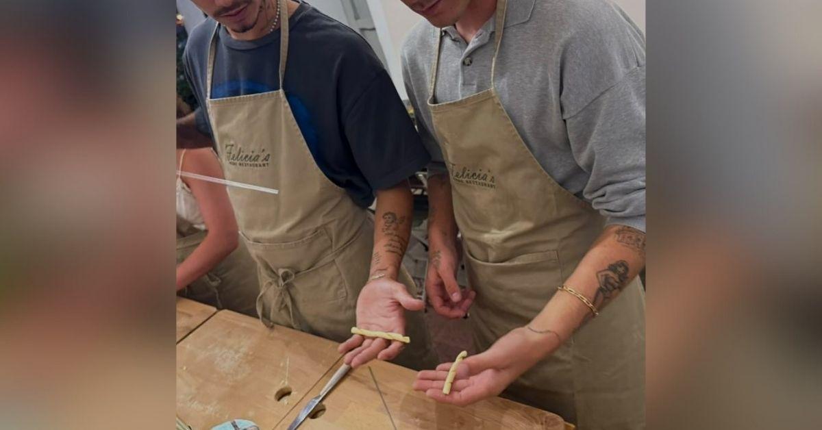 image of Romeo and Cruz Beckham attended a pasta-making class during their vacation.