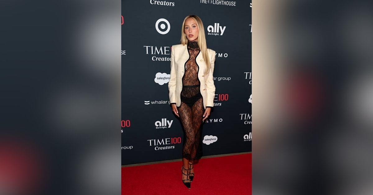 image of Alix Earle wowed at the 2026 TIME100 Creators Celebration in a black lace see-through catsuit and ivory blazer.