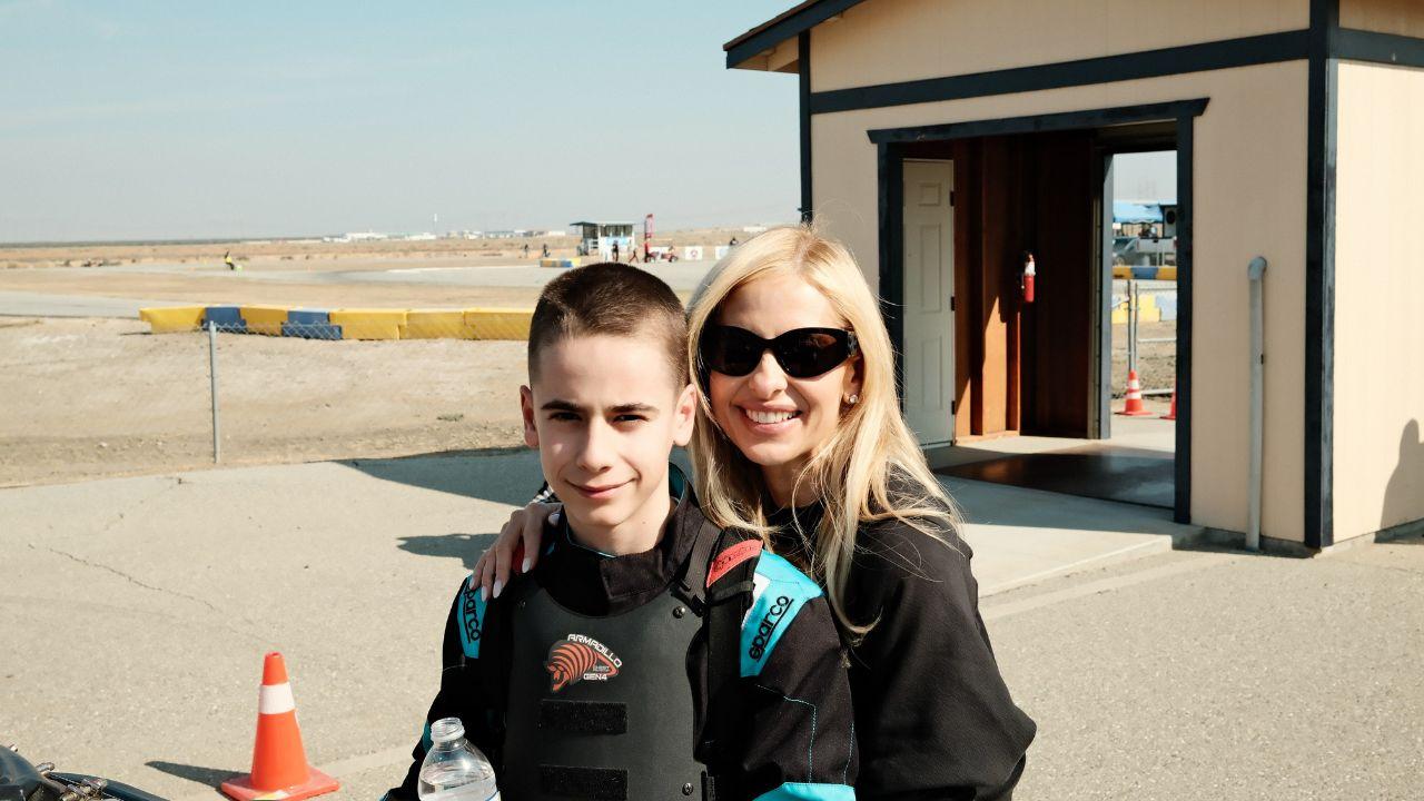 Image of Rocky wore a black and turquoise racing suit.