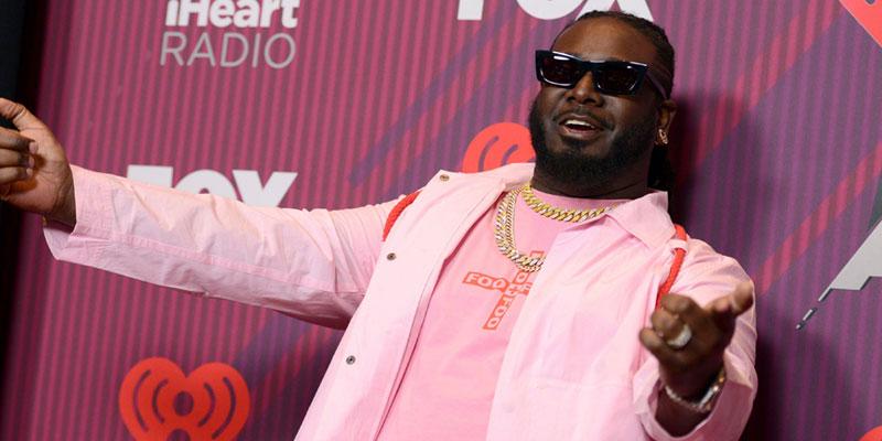 T-Pain poses in the press room at the iHeartRadio Music Awards, at the Microsoft Theater in Los Angeles t-pain broke money kids